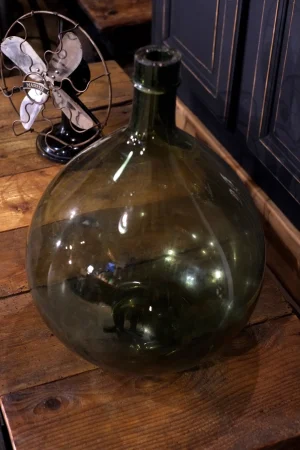 grosse bonbonne en verre vert ancienne Dame jeanne